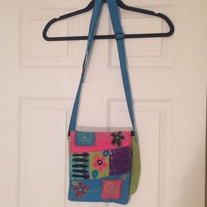 NWOT crossbody w/ laser cuts, appliqués & crystals